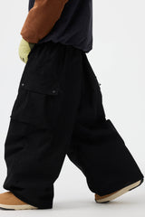 Pantalones de nieve de pana suave estructurados y holgados de color negro para hombre 